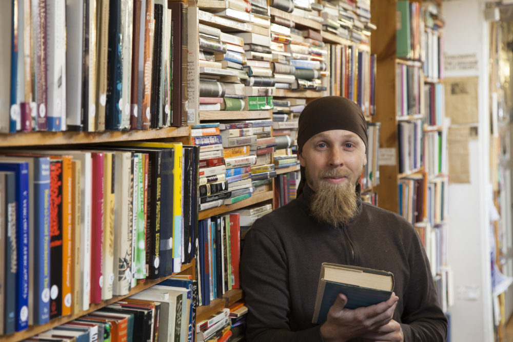 Person in books and antique store